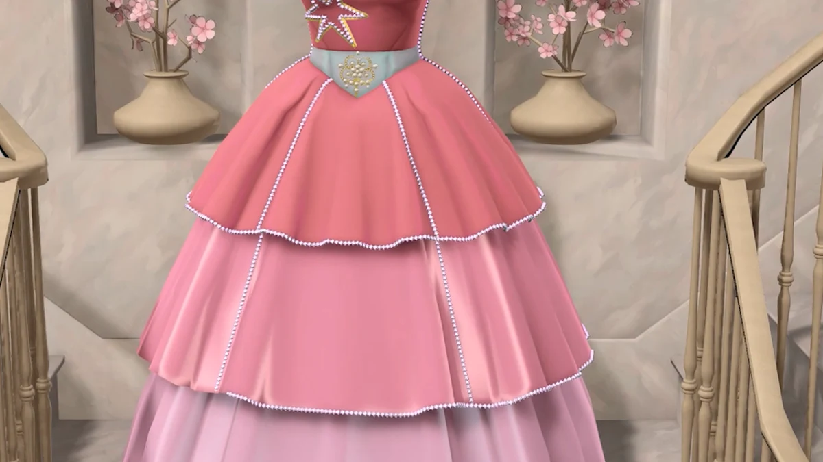 The pink dress is framed around its bow and layered skirt. It is a visual planning example, not evidence for a particular cost or accessory achievement.